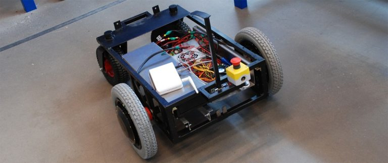 automotive engineering concept represented by compact robotic device with wheels A compact robotic device with wheels, representing an automotive engineering homework help