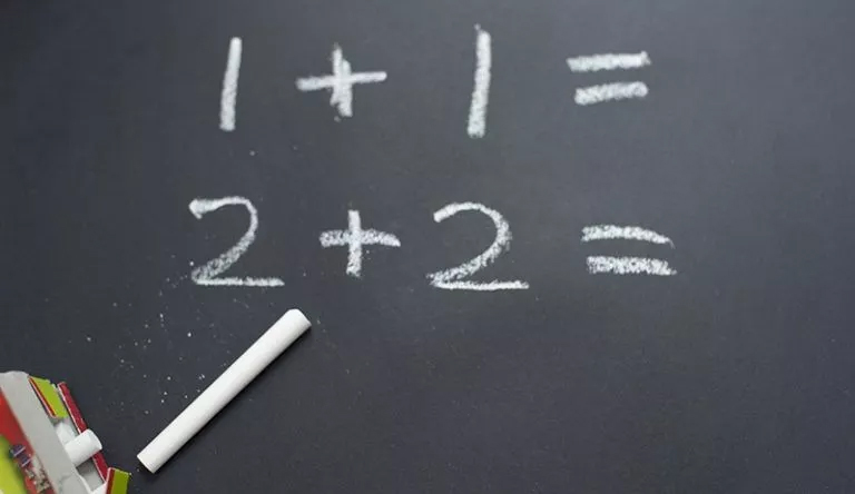 Fundamentals of Math: Get top-notch basic math homework help A chalkboard with numbers written on it, providing basic math homework help