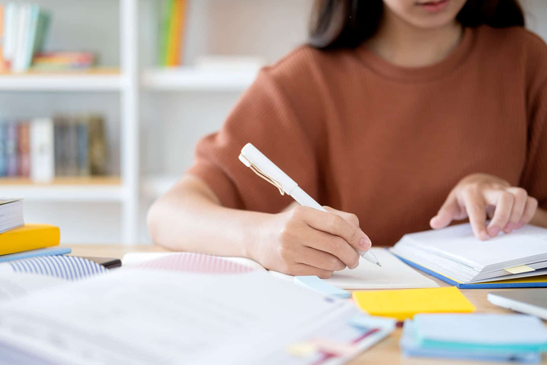 a student is deeply engaged or busy with college assignments and looking for help the image depicts the concept of college assignments