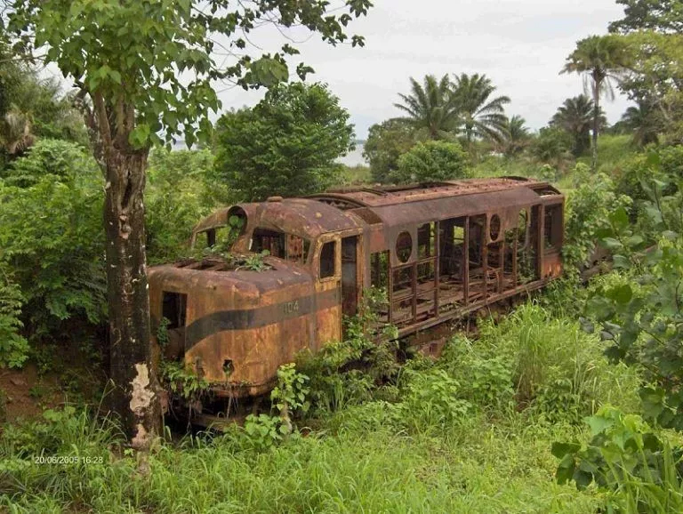 Corrosion homework help: Symbolizing Corrosion in Abandoned Train Cars An old rusted train car abandoned in the jungle, symbolizing Corrosion Assignment Help concept