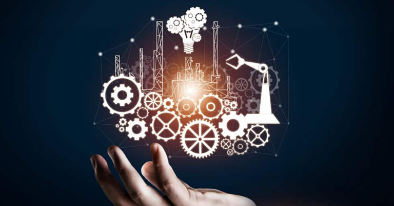 A hand holding a glowing image of industrial machinery, representing an engineering concept A hand holding a glowing image of industrial machinery, representing an engineering concept