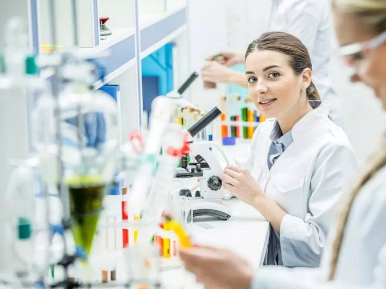 a footage of female student while completing her laboratory science homework task a student looking towards the camera while completing her Laboratory Science Assignment Help
