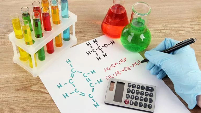 Chemistry Student Calculating Chemical Formula for Physical Chemistry Homework Help A chemistry student calculating a chemical formula using a calculator for their physical chemistry homework help