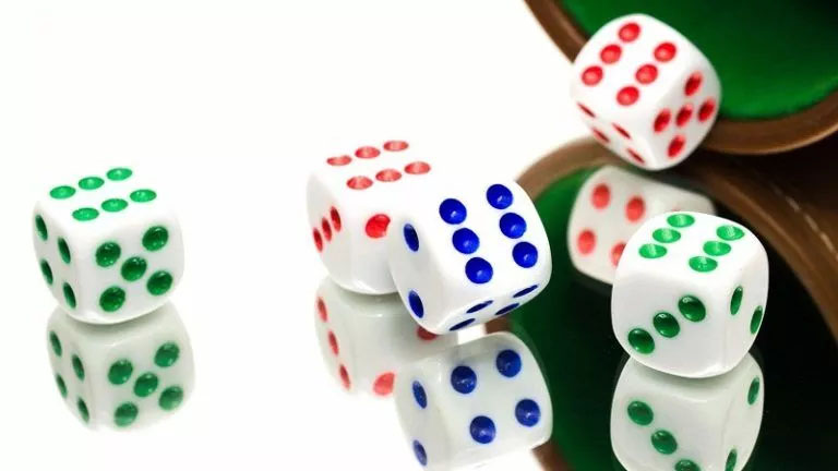 Probability in Action: Green and White Dice on a Table for Probability Homework Help Green and white dice on a table, representing a Probability Homework Help concept