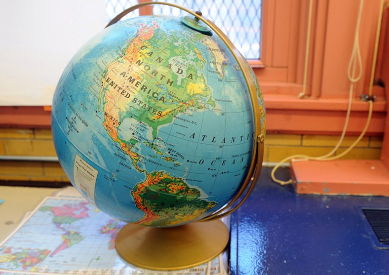 Social Studies Homework and Assignment Help: Globe on a Classroom Desk A globe on a desk in a classroom, symbolizing social studies homework and assignment help.