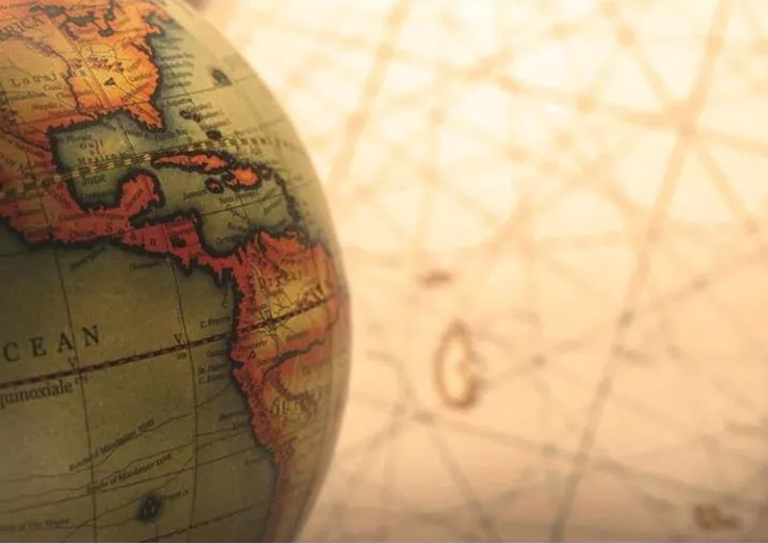 Exploring Social Studies: Antique Globe on Historical Map Antique globe on map, representing Social Studies Homework Help concept