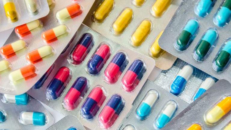 Therapeutics Assignment Concept: Colorful Pills in Packaging Many colored pills in a package, representing a therapeutics assignment concept